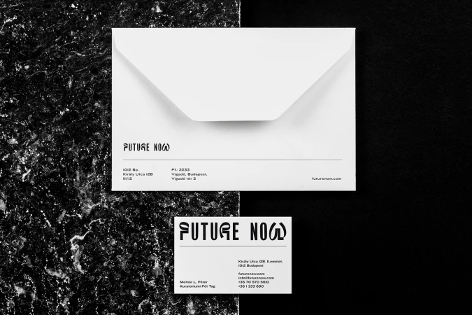 Elegant, minimalist branding mockup featuring a white envelope and business card on a black and marble background, showcasing a sleek, modern design.
