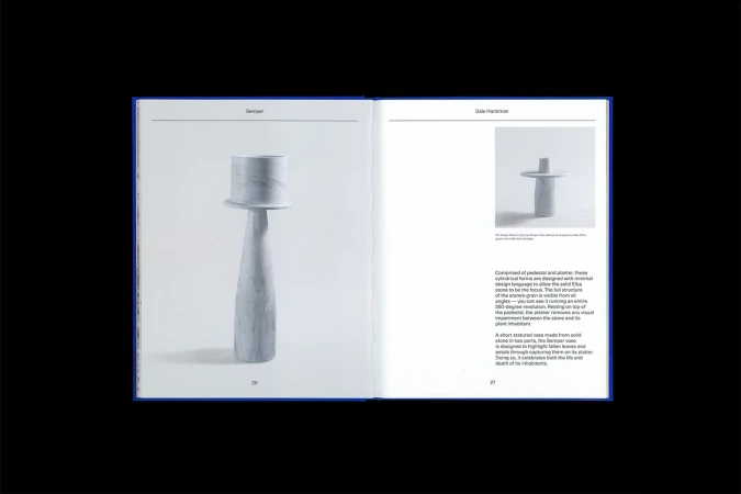 Open book spread showing a black and white photograph of a stone pedestal planter and descriptive typography text.