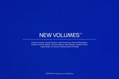 Blue graphic title card featuring white typography reading New Volumes with project credits and copyright info
