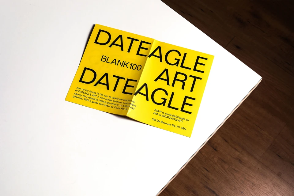 Bright yellow Dateagle Art event brochure lying on a white surface, showcasing event details and contact information.