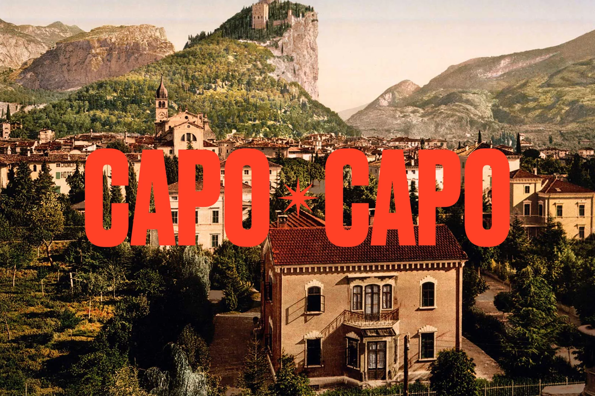 Cityscape of Arco, Italy with mountains, trees and houses beneath a large red text overlay reading 'CAPO CAPO'.