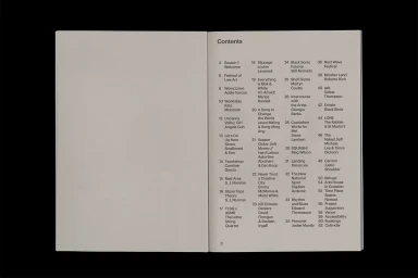 Open book page displaying a contents index with black typography on a pale cream background.