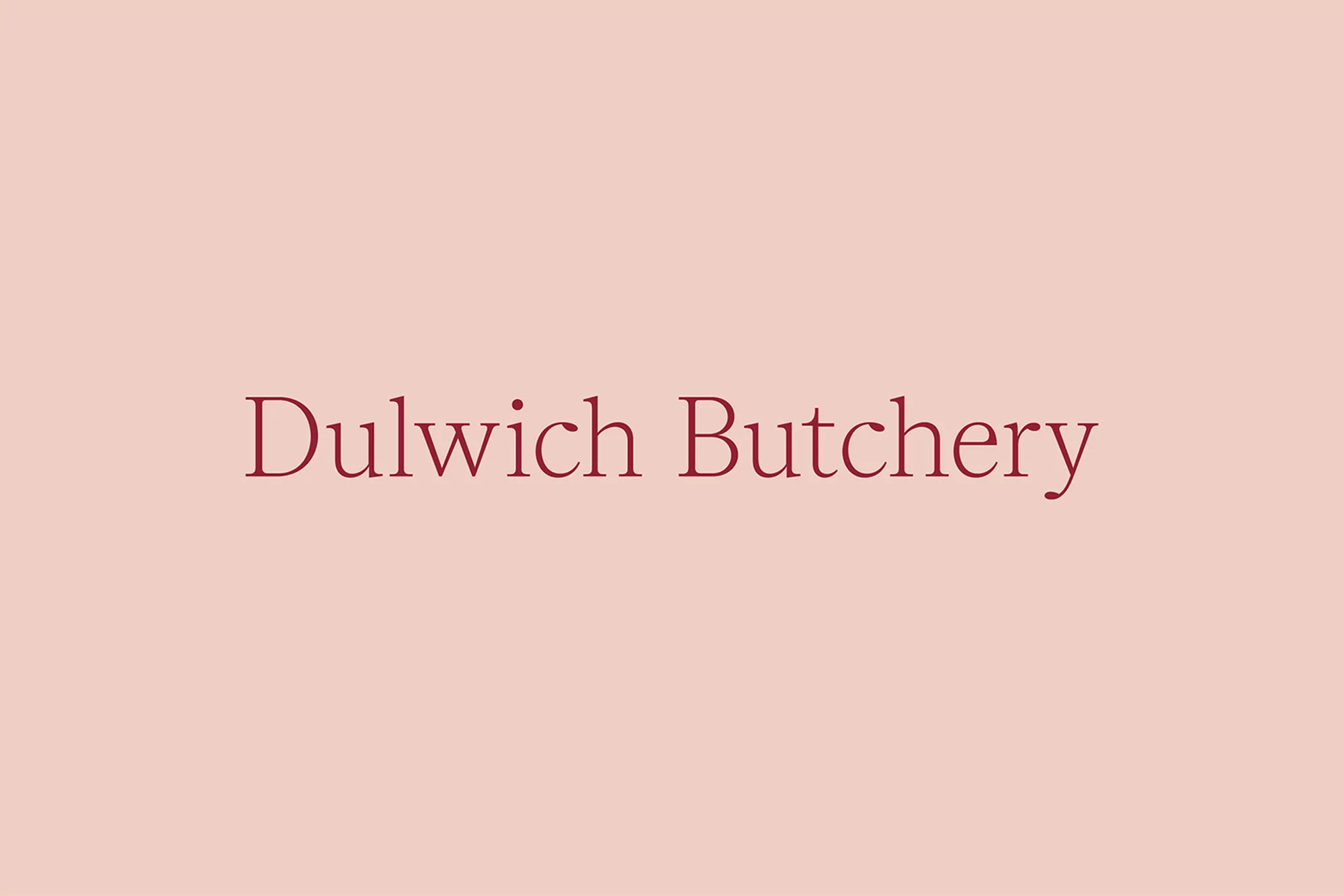 Text-based image with 'Dulwich Butchery' in burgundy font centered on a blush background, ideal for business branding or a minimalist design.