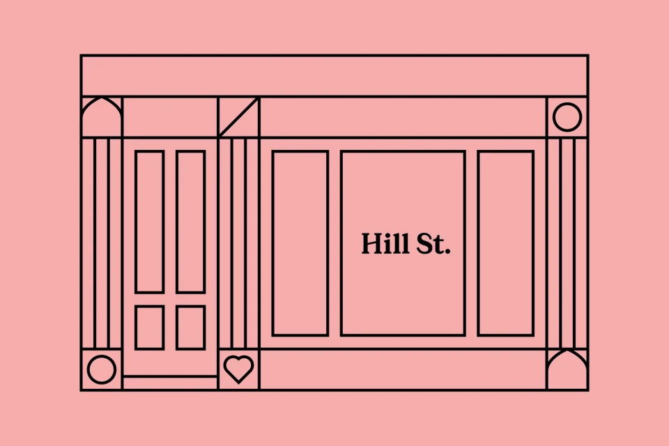 Illustration of a building facade with a door and window featuring the text "Hill St." on a salmon-colored background.