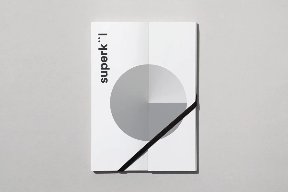 Geometric book cover on gray background with a circle design divided into three sections with black diagonal line and sans-serif font.