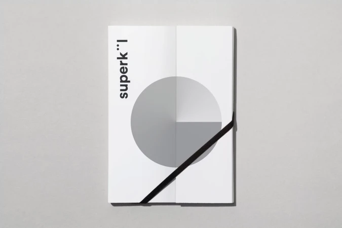 Geometric book cover on gray background with a circle design divided into three sections with black diagonal line and sans-serif font.