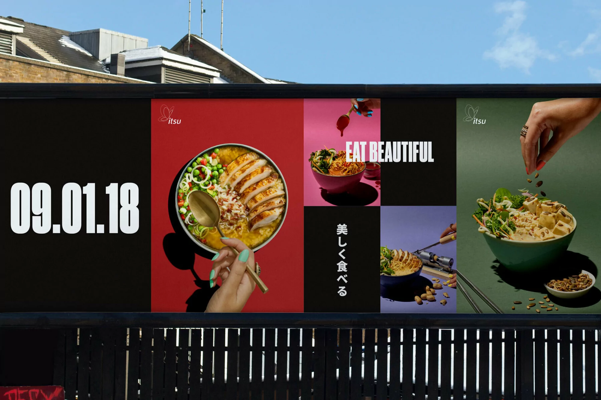 Outdoor advertisement for Itsu featuring food bowls, hands, and the date '09.01.18' against an urban background with a glimpse of the sky.