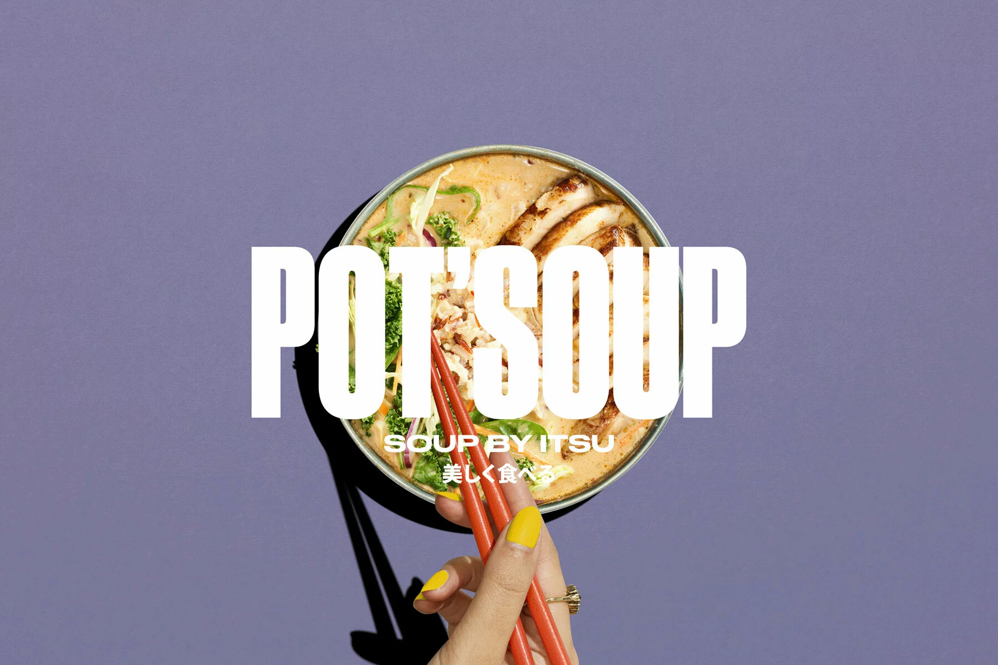 Overhead shot of pot soup with sliced chicken and vegetables, served with chopsticks held by a manicured hand against a purple backdrop.