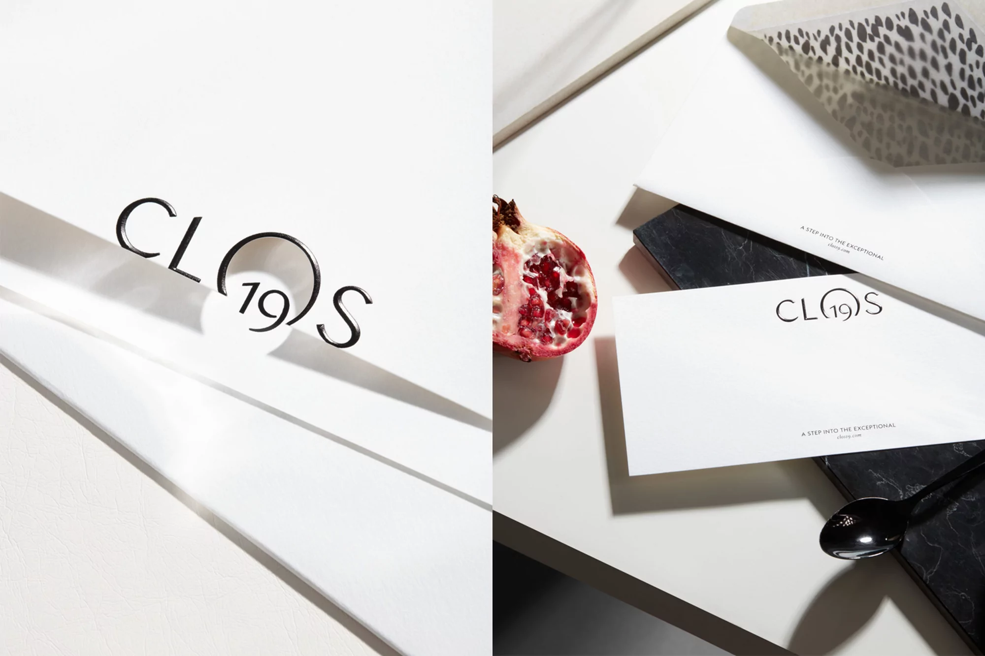 Promotional still life featuring the Clos19 logo, a sliced pomegranate, a black marble coaster, a black spoon, and dappled light.