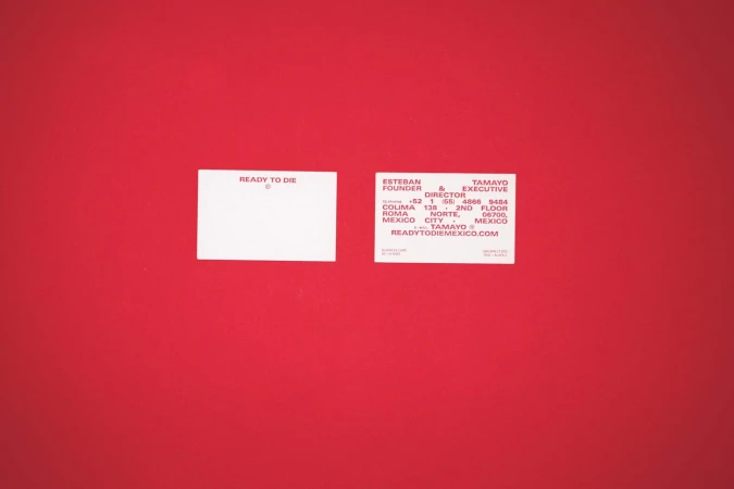 Two business cards on a red background featuring the company name Ready to Die and contact information for Esteban Tamayo in Mexico.