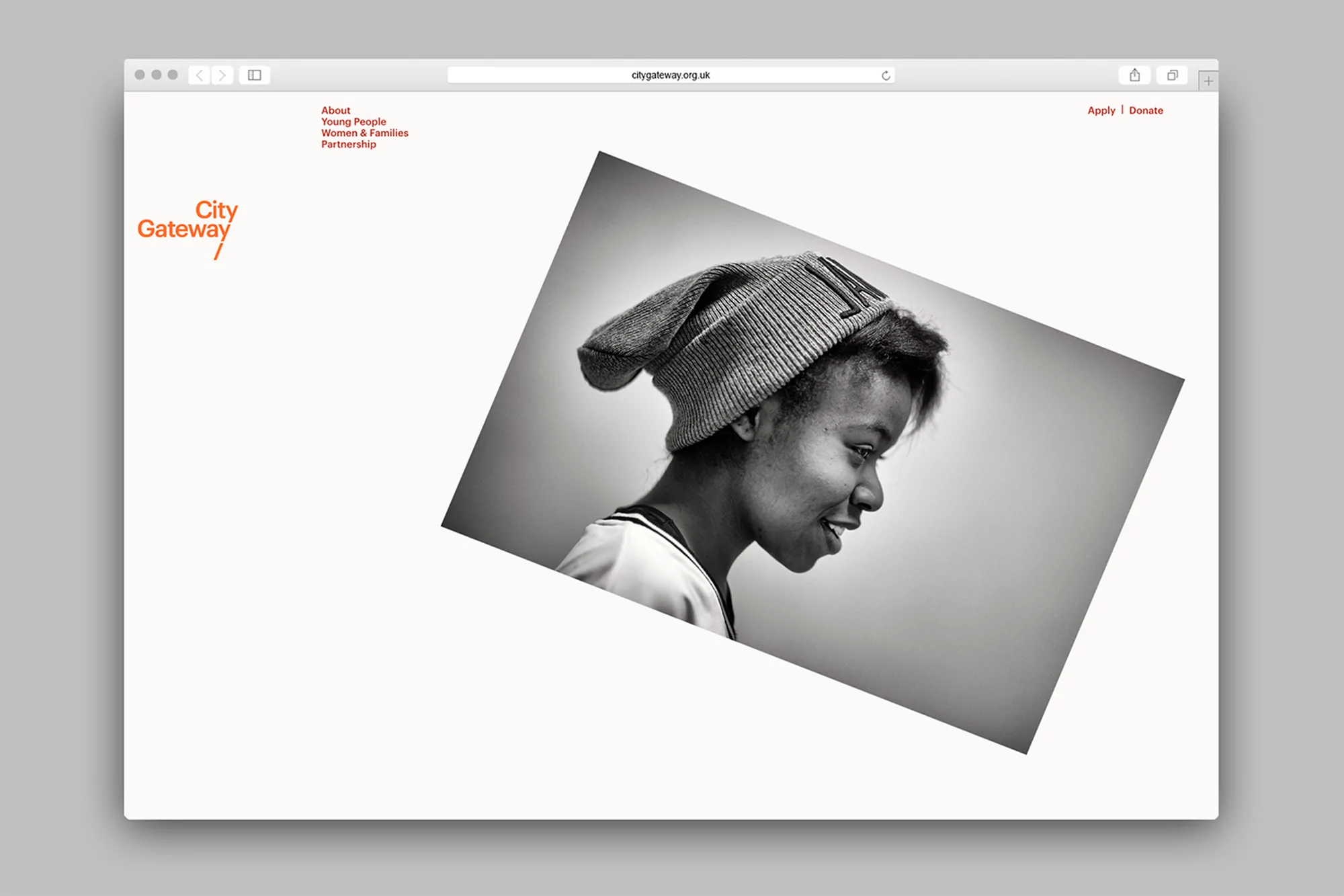 Screenshot of City Gateway website featuring a black and white photo of a smiling young woman wearing a beanie.