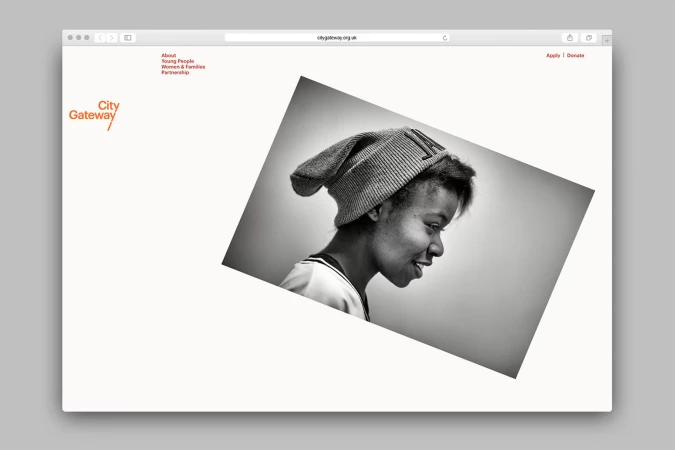 Screenshot of City Gateway website featuring a black and white photo of a smiling young woman wearing a beanie.