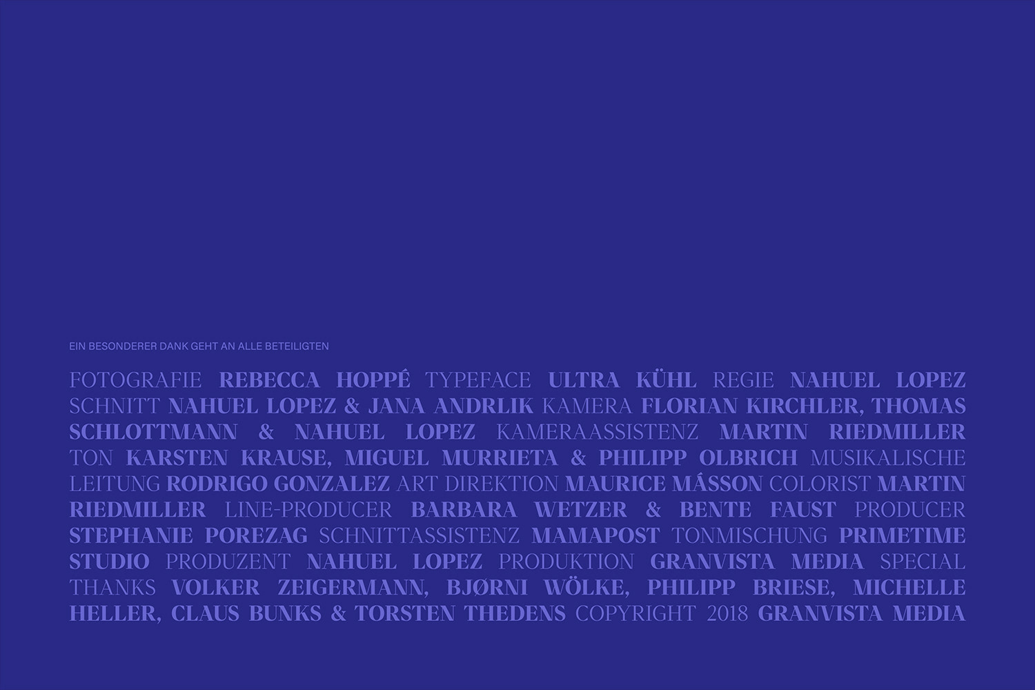 End credits display in indigo, listing production staff, copyright details, and acknowledgments on a solid-color background.
