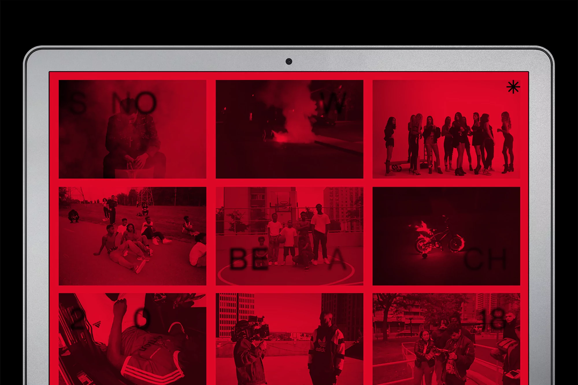 Digital display of a tablet screen showing a grid of video stills edited with a red filter and overlaid text in contrasting black.