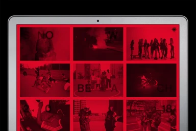 A laptop screen displaying a grid of red-toned monochromatic photographs and typography for Snow Beach brand identity.