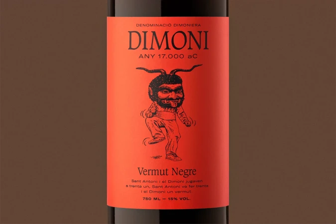 Red wine bottle label featuring an illustration of a demon in black ink. The label includes the name DIMONI and other descriptive text.