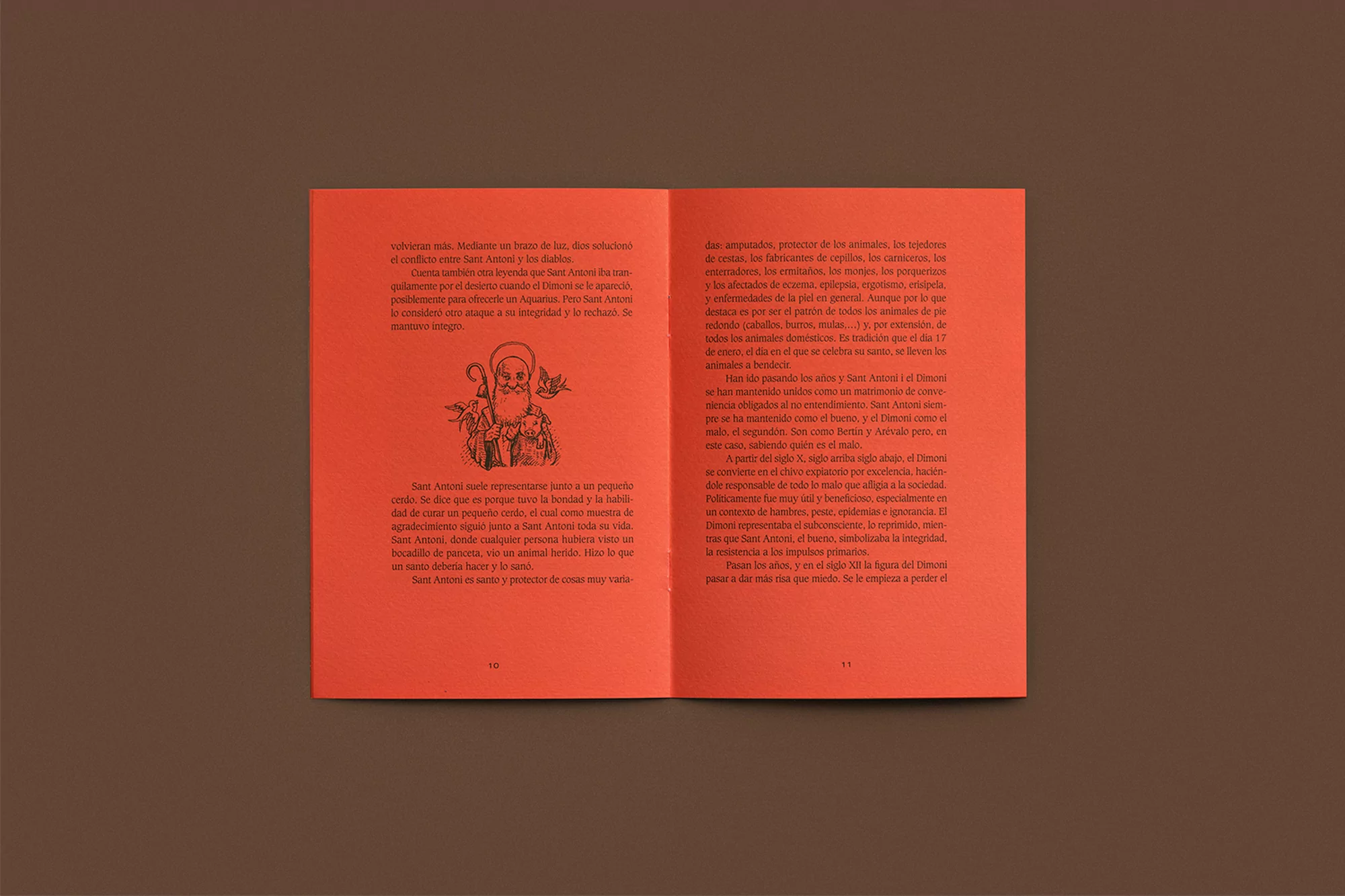 Open book with Spanish text and illustrations of Saint Anthony, set against a brown background.
