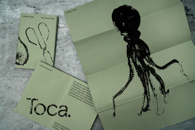 Promotional image for Canela Fina featuring folded brochures and a booklet with black ink illustrations of an octopus and other designs.