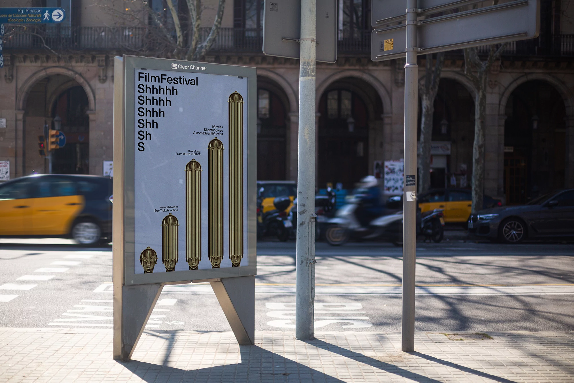 Outdoor advertising poster featuring a film festival design in an urban environment with blurred motion of cars and people in the background.