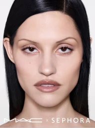 Close-up beauty portrait of Gabbriette featuring sleek dark hair and neutral lips against a plain white background for MAC Cosmetics.