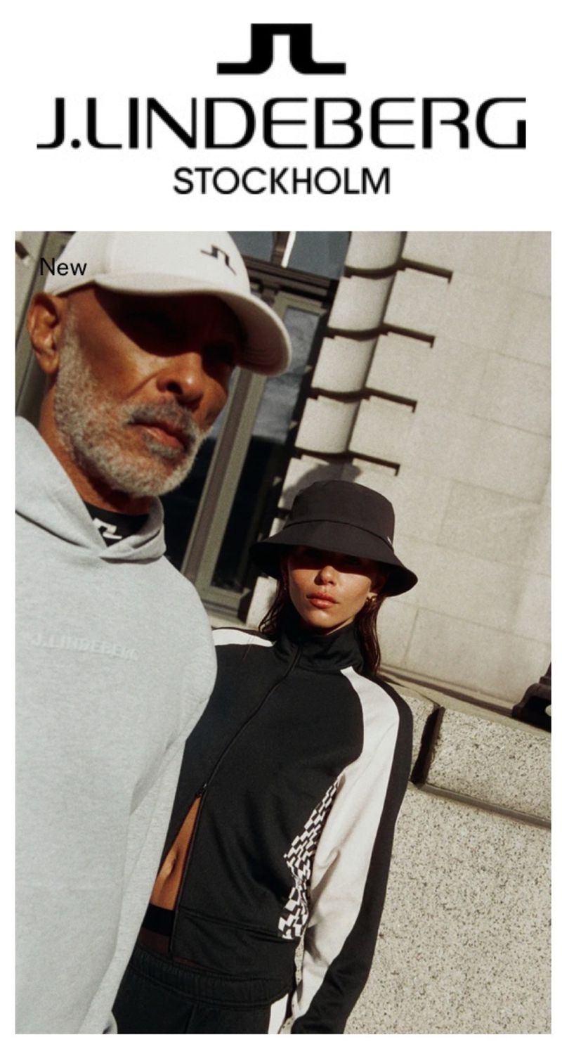 Two people posing outdoors wearing athletic apparel, with the J.Lindeberg logo visible. An adult male is wearing a light grey hoodie and a white baseball cap.