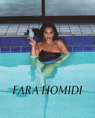 Woman in a swimming pool holding a blue bird perched on her finger, photographed by Zoë Ghertner for Fara Homidi