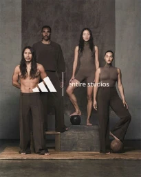 Four diverse models posing in dark brown apparel against a textured backdrop for the Adidas x Entire Studios collaboration.