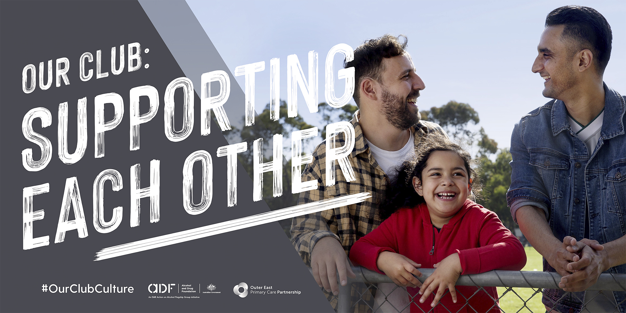 Outdoor photo of two adult men and a young girl smiling and leaning on a fence, promoting community spirit and support.