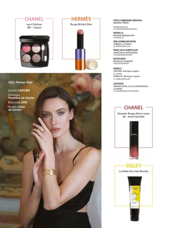 Advertisement featuring a woman with jewelry and makeup products from Chanel, Hermès, Sisley, and Cartier against a soft backdrop.
