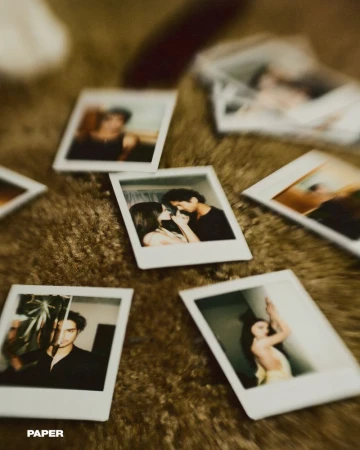 Several polaroid photographs on a brown, textured surface, featuring portraits of a couple and individual adults in indoor settings.