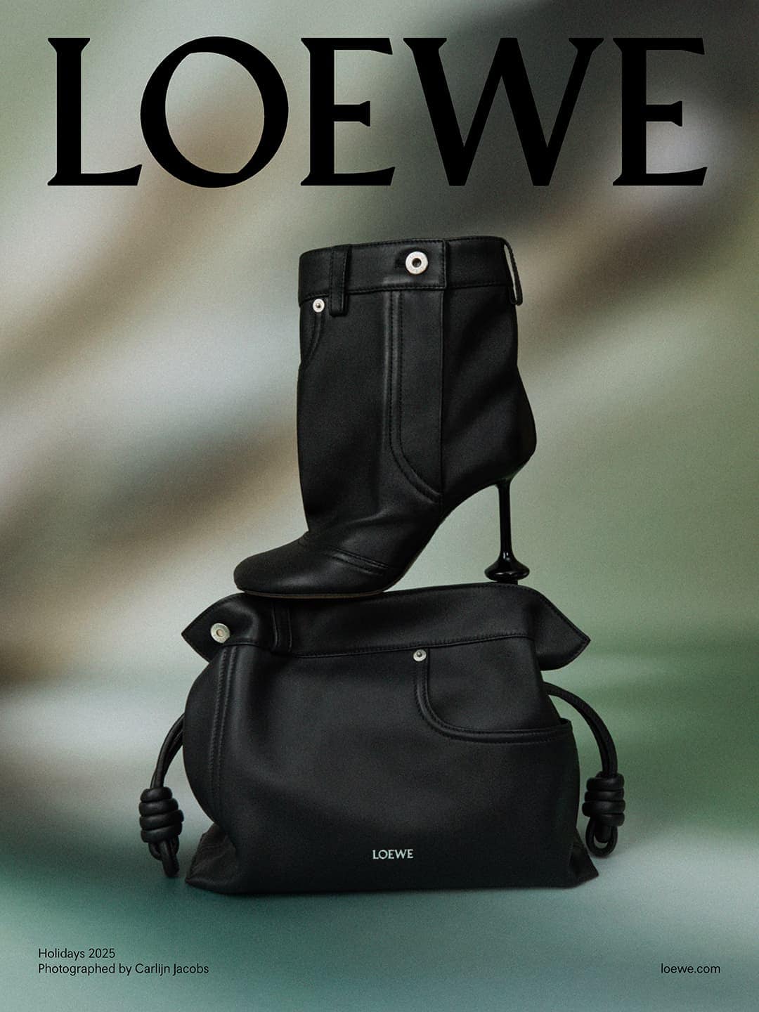 Loewe advertisement featuring a black leather handbag with drawstring and a matching heeled boot, set against a blurred backdrop.