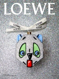 Loewe holiday ornament featuring a glittery panda face with branded ribbon against a silver background
