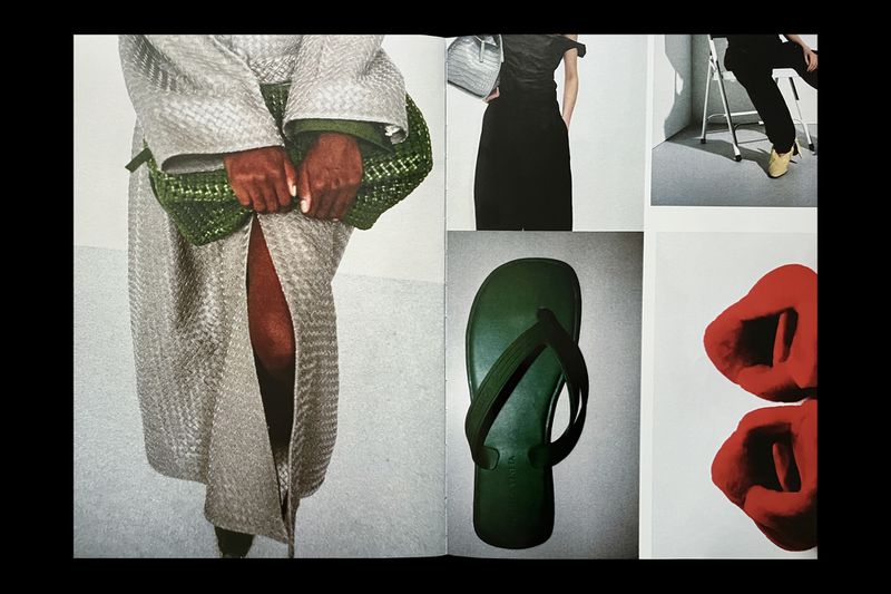 Collage featuring a light grey textured robe, a green handbag, a black dress, a sandal, and red sculptures on a white background.