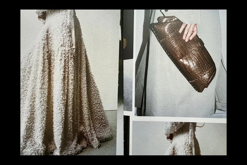 Fashion editorial shot featuring a beige textured coat and a model holding a crocodile-skin clutch purse in a neutral setting.