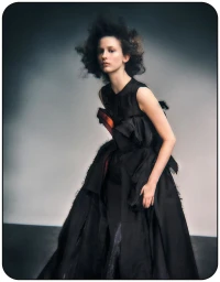 Model Melinda Kiss in a black sculptural dress with voluminous silhouette for Harper's Bazaar Germany editorial by Dima Hohlov