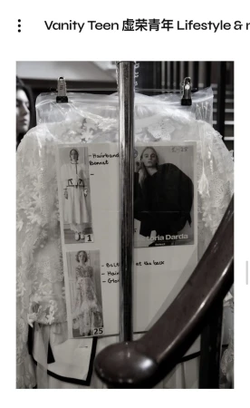 Behind the scenes glimpse of high fashion: garments on a rack, design sketches, monochromatic aesthetic. Ideal for fashion creatives.