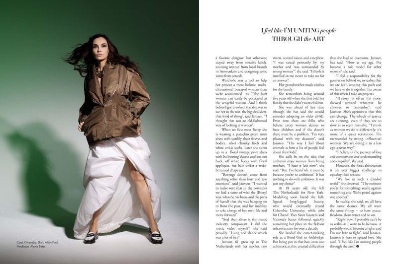 Fashion shot of woman in olive jacket and white skirt, wearing loafers, against green background. Editorial fashion photography.