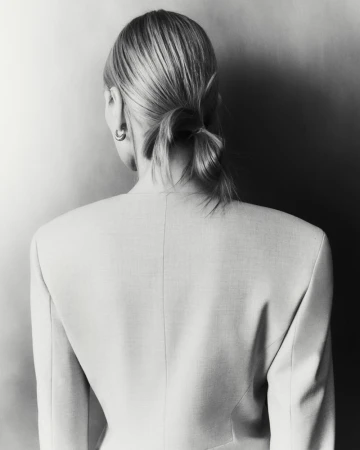 Model Liz Kennedy shown from the back wearing a structured jacket for Lafayette 148 Fall 2026 Ready to Wear