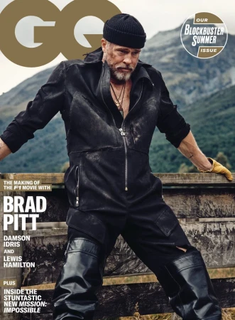 Brad Pitt on the cover of GQ, wearing a black jumpsuit and beanie, posing outdoors with mountains and trees visible in the background.