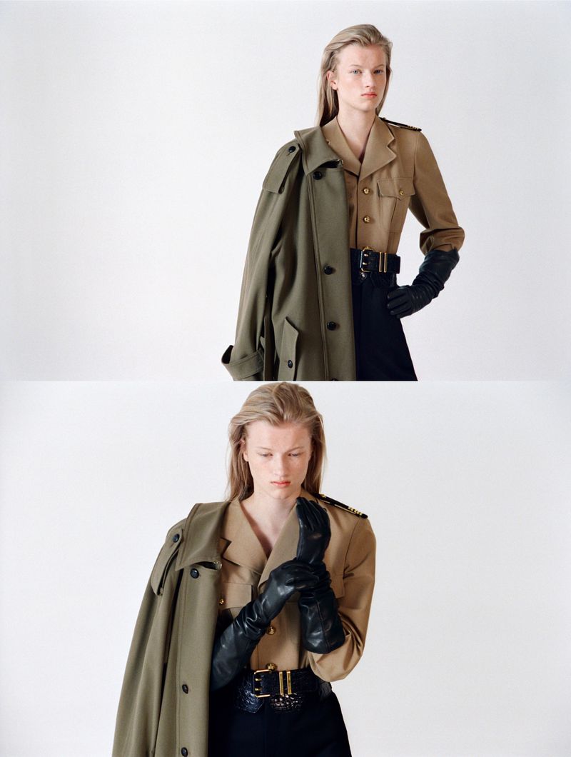 A striking fashion shot features a woman in a tan top, black skirt, and black gloves, with a trench coat draped over her shoulder.