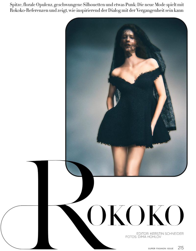 Model wearing a black off-the-shoulder mini dress with a sheer veil against a grey backdrop for Harper's Bazaar Germany.