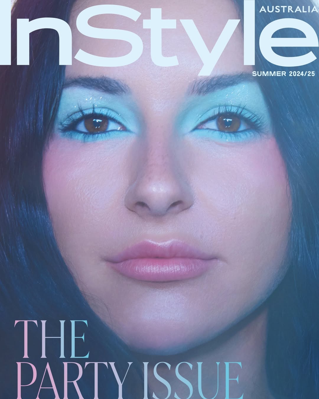 InStyle Australia magazine cover featuring a close-up portrait of a woman with bright blue eyeshadow and pink blush, summer 2024/25 edition.