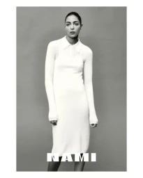 Nora Attal wearing a white collared knit dress against a grey studio backdrop for Nami Drop 4