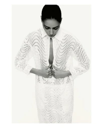 Model Nora Attal wearing a white lace dress for the Nami Drop 4 project, shot by photographer Robin Galiegue.