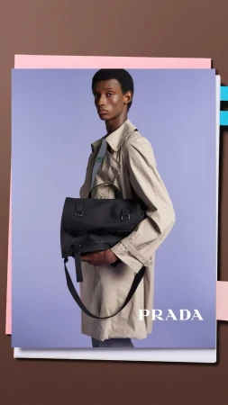 A person holds a Prada bag in a studio shot, showcasing a stylish trench coat and a sleek, professional aesthetic with a clean backdrop.