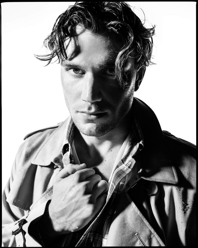 Portrait of a man wearing a trench coat against a white background for the Burberry 170th Anniversary 2025 Campaign
