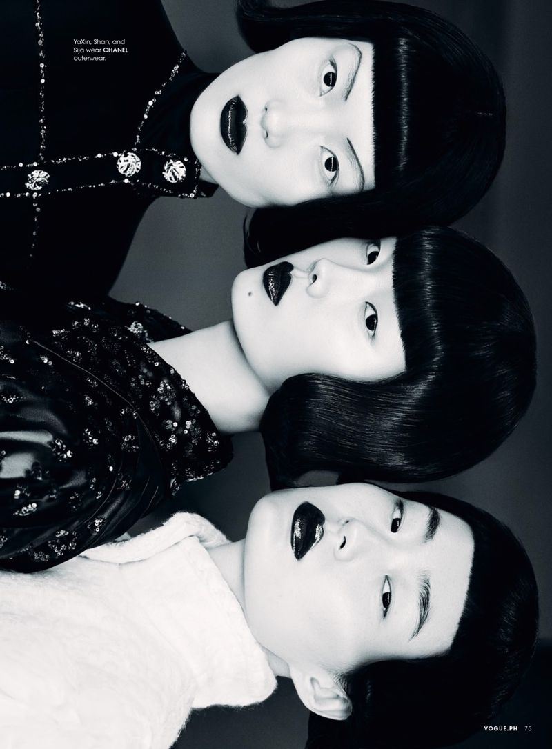 Black and white fashion portrait features three Asian women with blunt bangs, dramatic dark lipstick, and stylish textured outerwear.