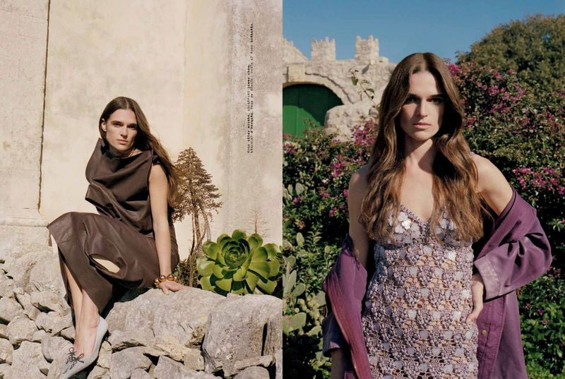 Outdoor fashion editorial featuring an adult female model in a brown dress sitting on a stone wall, and an outdoor garden shot.