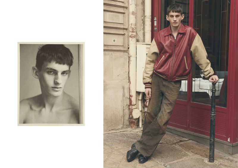 Male model poses in a leather jacket and pants next to a red doorway on a stone street. Inset shows a B&W headshot.