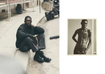 Man seated on a street curb wearing a black sweatshirt and dark pants, with a framed portrait inset on the right.